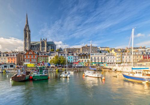 st colman's cathedral and harbour in cork, ireland
