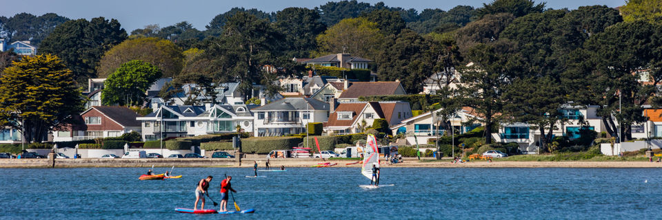 poole harbour with windsurfers in dorset
